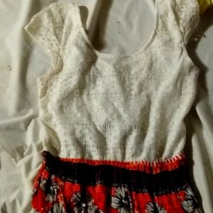 It's a floral dress that's got straps and goes down passed the knees.